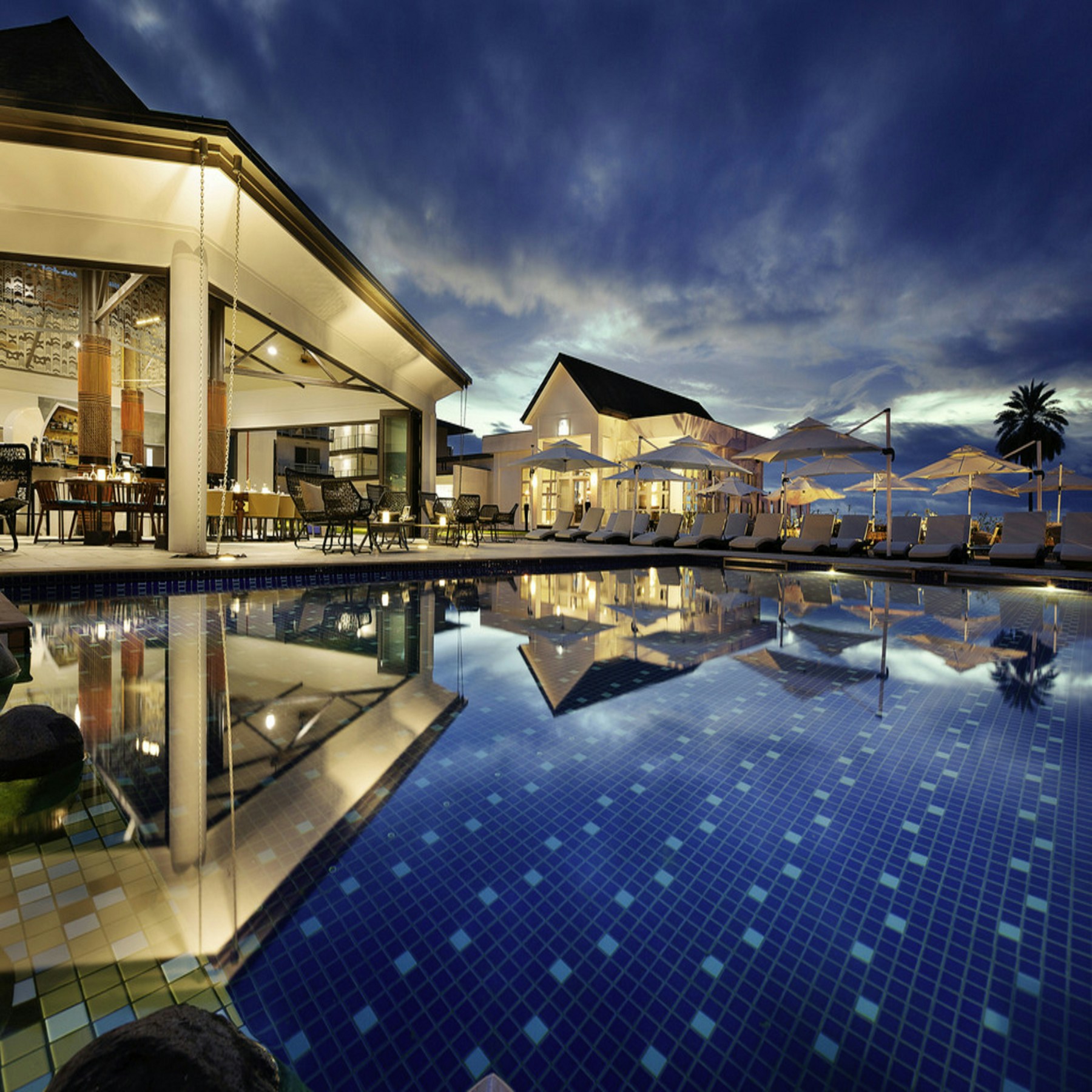 Palm trees and a tranquil resort pool
